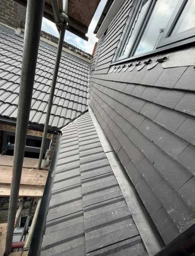 Dormer cheek re-tiled with new tiles