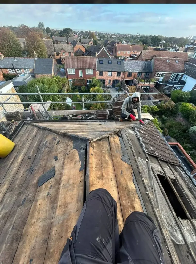 Hip roof being stripped for repair