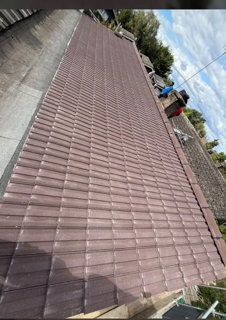 Completed red tiled roof repair